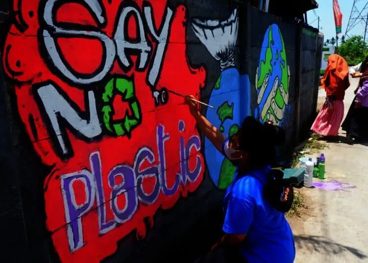 Potret Relawan Tanam Mangrove di Pulau Sampah Tanjung Burung