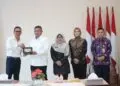 SERAH TERIMA -- Acara serah terima hibah sertifikat lahan, antara Pemkab Pandeglang dan Bulog, yang berlangsung di Kantor Badan Pertanahan Kabupaten Pandeglang, Kamis (3/9/2026). (ISTIMEWA)